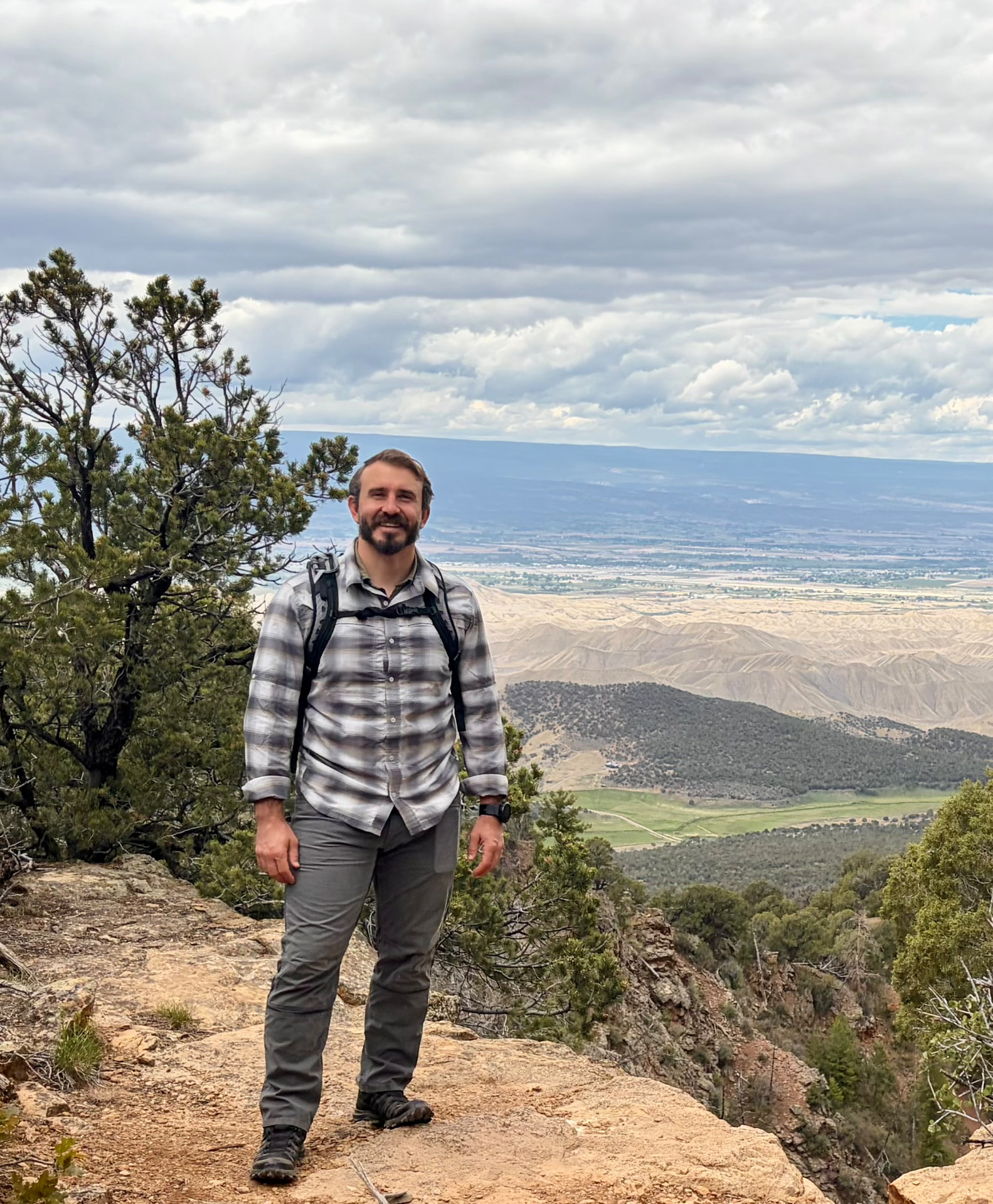 Cody, Founder & CEO of Onward Dawn Adventure, at a mountain overlook